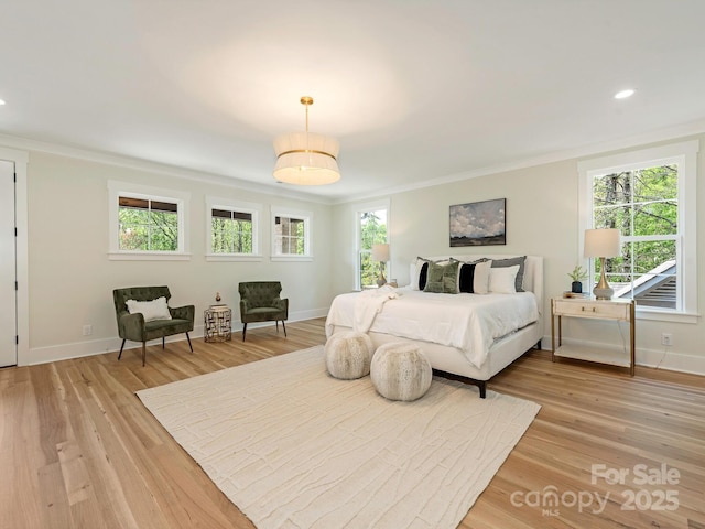 2909 Hanson Dr, Charlotte, NC 28207 - bedroom featuring baseboards, light wood finished floors, multiple windows, and ornamental molding