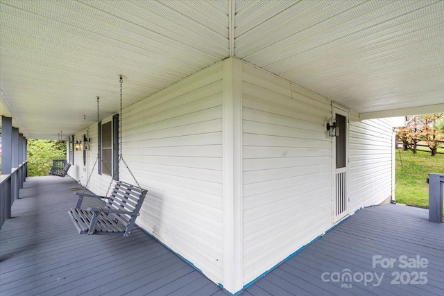 wooden terrace featuring a porch
