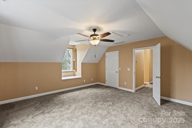 additional living space with visible vents, a ceiling fan, lofted ceiling, and carpet floors