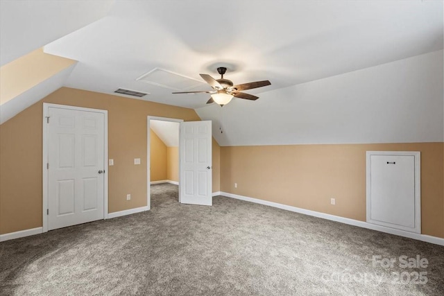 bonus room with ceiling fan, visible vents, carpet floors, lofted ceiling, and baseboards