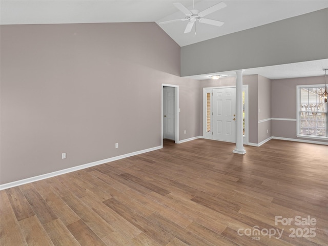 135 S Sunberry Trl, Fletcher, NC 28732 - interior space with wood finished floors, high vaulted ceiling, baseboards, and ceiling fan with notable chandelier