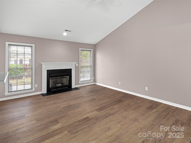 135 S Sunberry Trl, Fletcher, NC 28732 - unfurnished living room with visible vents, baseboards, wood finished floors, and lofted ceiling