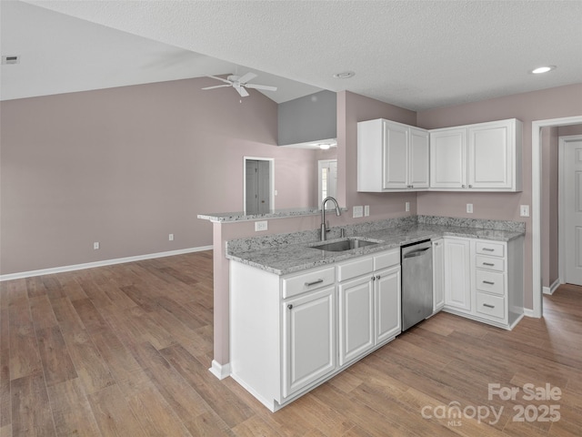 135 S Sunberry Trl, Fletcher, NC 28732 - kitchen with a ceiling fan, white cabinets, dishwasher, a sink, and baseboards