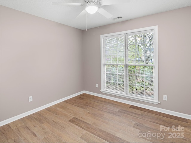 135 S Sunberry Trl, Fletcher, NC 28732 - empty room featuring visible vents, baseboards, a ceiling fan, and wood finished floors