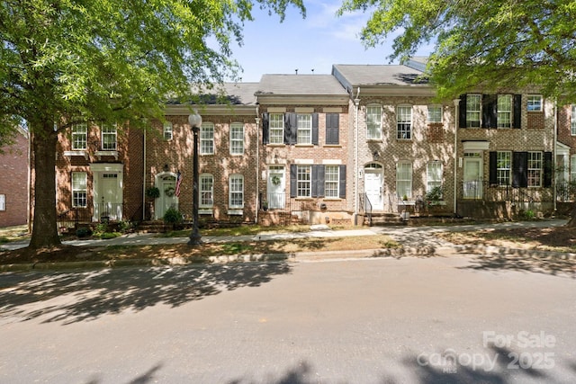 view of front of house with brick siding