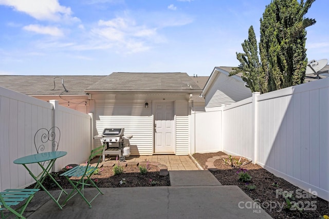 doorway to property featuring a patio area and fence