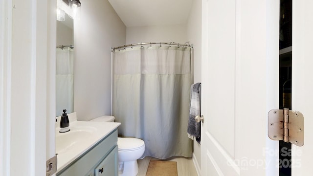 full bathroom featuring toilet and vanity