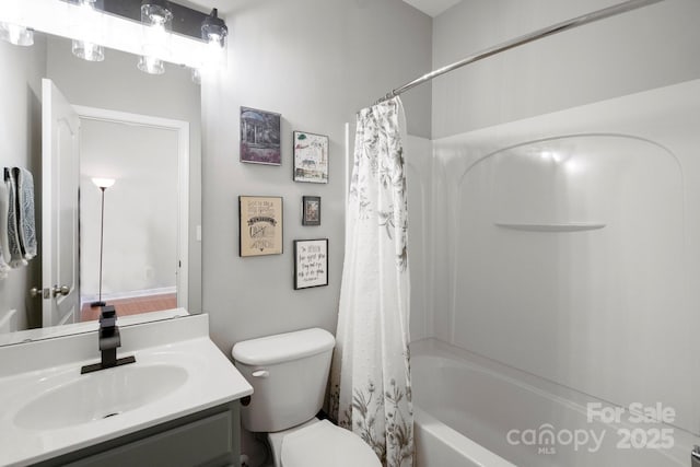 full bathroom with toilet, shower / tub combo with curtain, and vanity