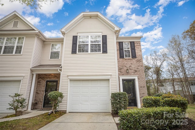 7445 Abigail Glen Dr, Charlotte, NC 28212 - view of property with an attached garage, brick siding, and concrete driveway