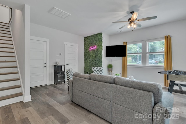 648 W End Dr, Charlotte, NC 28208 - living room with stairs, a ceiling fan, and wood finished floors
