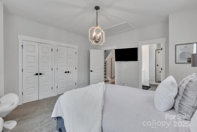 648 W End Dr, Charlotte, NC 28208 - carpeted bedroom featuring attic access, two closets, and connected bathroom