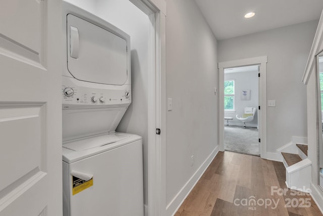 648 W End Dr, Charlotte, NC 28208 - washroom featuring stacked washer / drying machine, wood finished floors, recessed lighting, and baseboards