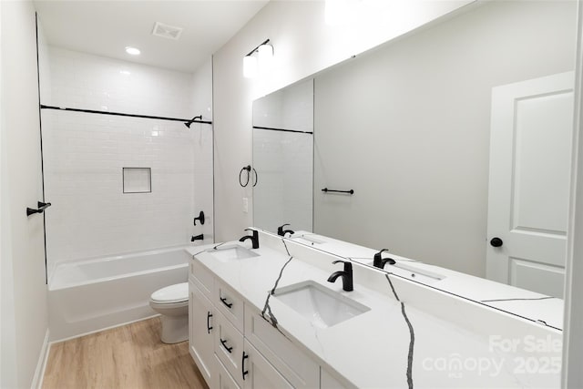 615 Billingsley Rd, Charlotte, NC 28211 - bathroom with a sink, toilet, double vanity, and wood finished floors