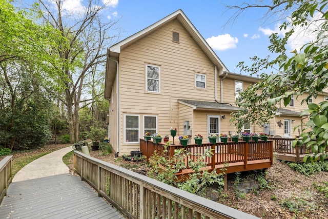 back of house featuring a deck