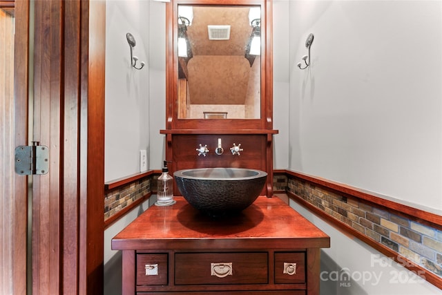 bathroom featuring vanity and visible vents