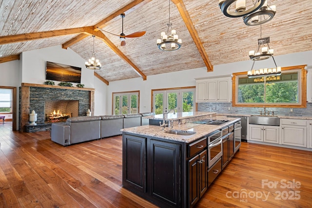 5546/5510 Hoodtown Rd, Sharon, SC 29742 - kitchen with white cabinets, a sink, and an inviting chandelier