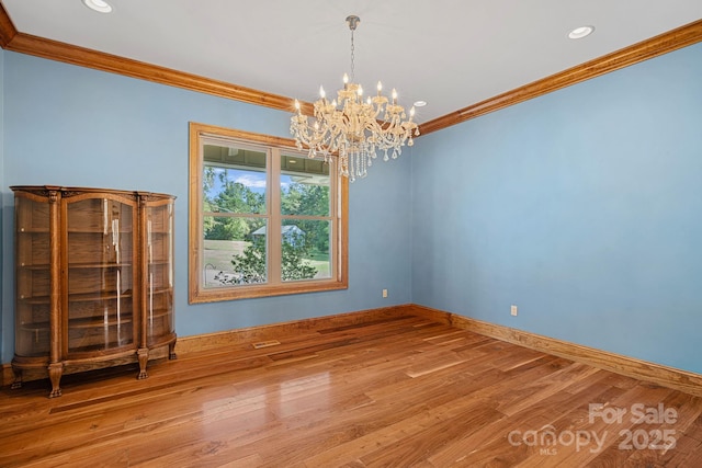 5546/5510 Hoodtown Rd, Sharon, SC 29742 - empty room featuring crown molding, wood finished floors, baseboards, recessed lighting, and an inviting chandelier
