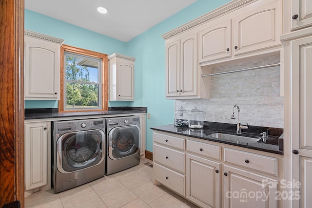5546/5510 Hoodtown Rd, Sharon, SC 29742 - washroom with light tile patterned flooring, washer and clothes dryer, cabinet space, and a sink