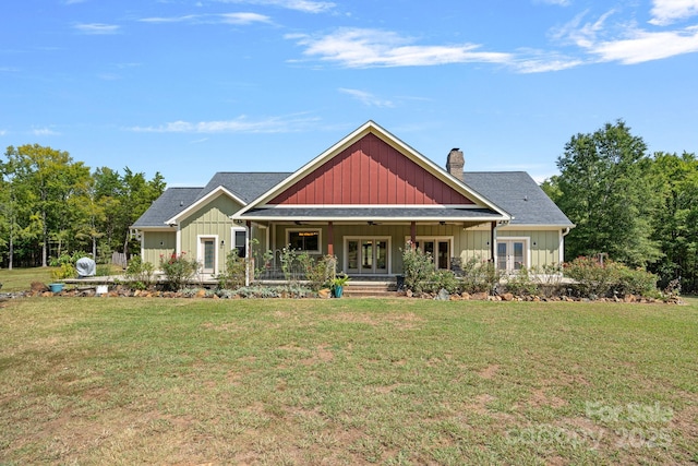 5546/5510 Hoodtown Rd, Sharon, SC 29742 - view of front of home with french doors, board and batten siding, ceiling fan, and a front lawn