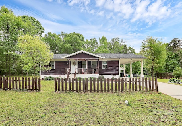 8301 Washington Blvd, Charlotte, NC 28262 - view of front of house with a fenced front yard, a porch, a front lawn, concrete driveway, and an attached carport