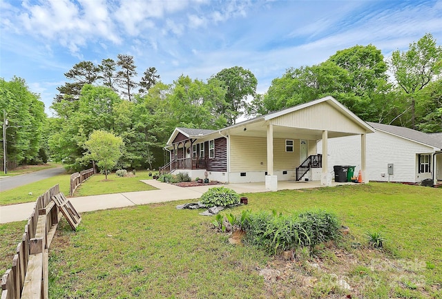 8301 Washington Blvd, Charlotte, NC 28262 - view of side of home with a yard, a carport, fence, and crawl space