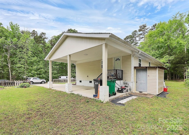 8301 Washington Blvd, Charlotte, NC 28262 - exterior space featuring crawl space, a carport, a yard, and fence