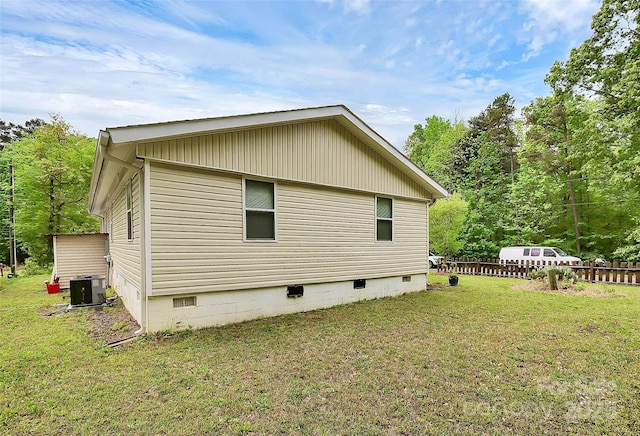 8301 Washington Blvd, Charlotte, NC 28262 - view of property exterior with a yard, fence, cooling unit, and crawl space