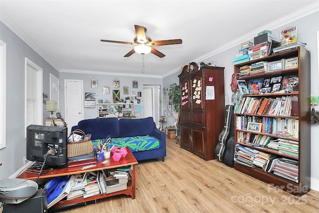 8301 Washington Blvd, Charlotte, NC 28262 - living area with crown molding, ceiling fan, and wood finished floors