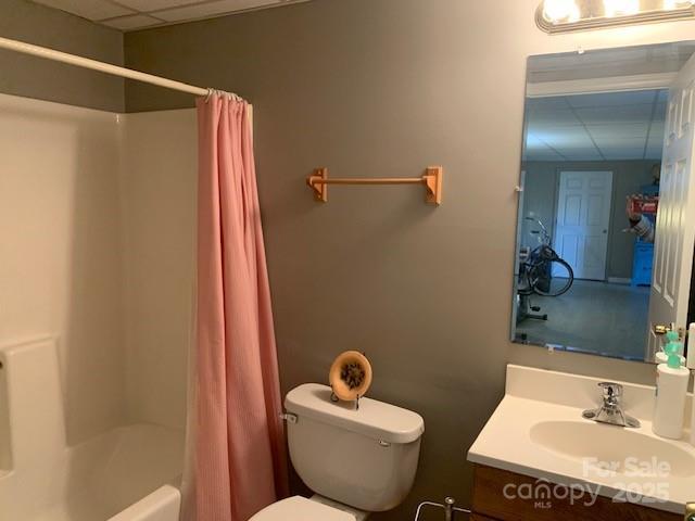 1474 Holiday Drive 14 & 15, Hendersonville, NC 28739 - bathroom with a paneled ceiling, vanity, toilet, and shower / tub combo with curtain