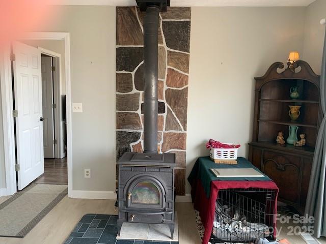 1474 Holiday Drive 14 & 15, Hendersonville, NC 28739 - detailed view of a wood stove and wood finished floors