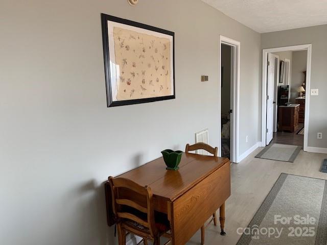 1474 Holiday Drive 14 & 15, Hendersonville, NC 28739 - dining area featuring light wood-style floors and baseboards