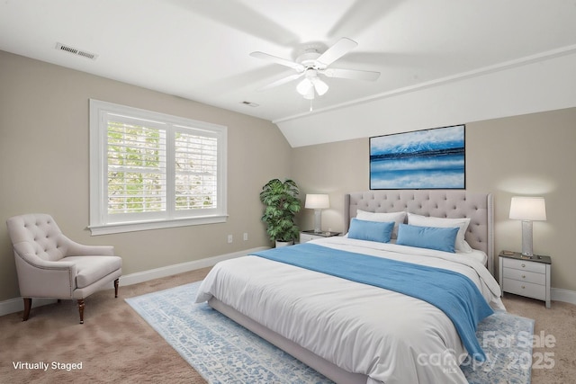 bedroom featuring baseboards, visible vents, and light colored carpet