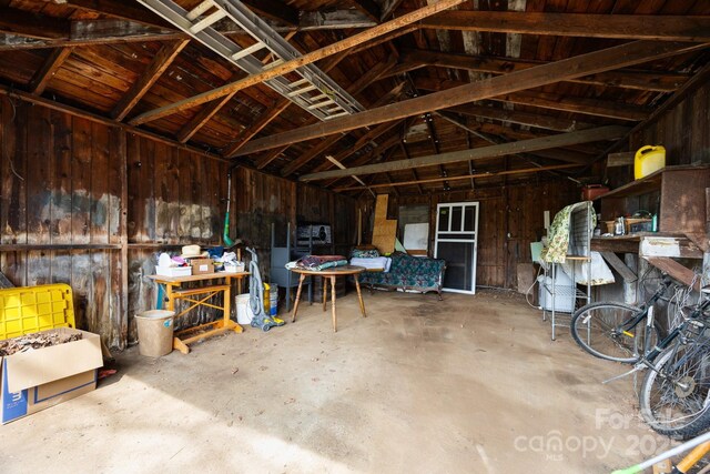 67 Montana Ave, Asheville, NC 28806 - interior space featuring unfinished concrete floors and lofted ceiling