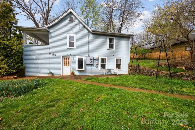 67 Montana Ave, Asheville, NC 28806 - rear view of house featuring fence and a lawn