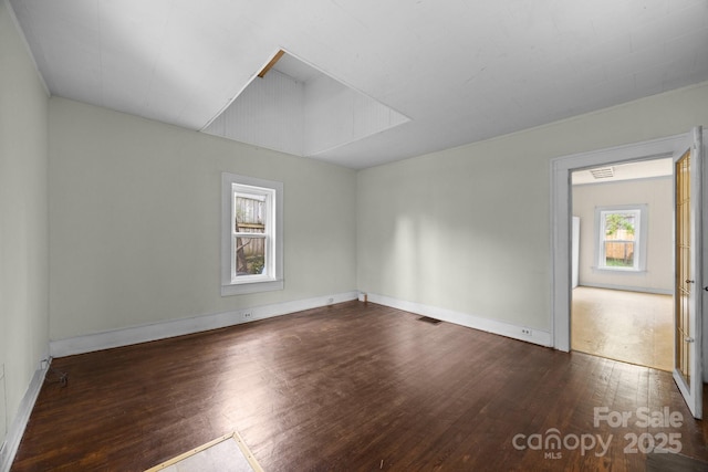 67 Montana Ave, Asheville, NC 28806 - unfurnished room with visible vents, baseboards, and wood finished floors