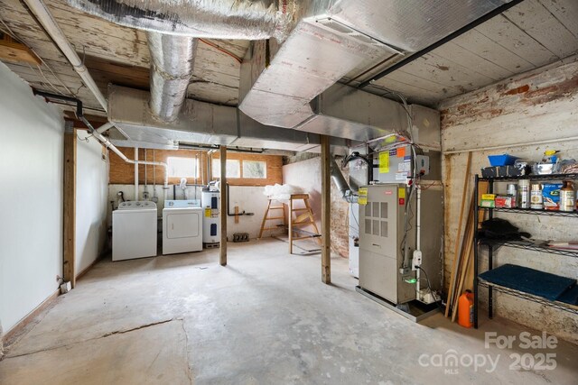 67 Montana Ave, Asheville, NC 28806 - basement featuring water heater and washing machine and dryer