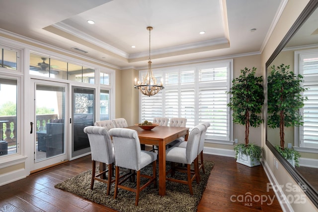 288 Macon Ave Unit 108, Asheville, NC 28804 - dining area with crown molding, a notable chandelier, a raised ceiling, dark wood finished floors, and visible vents