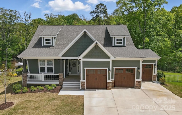 4120 Spring Cove Way, Belmont, NC 28012 - craftsman house featuring fence, driveway, covered porch, and a front yard