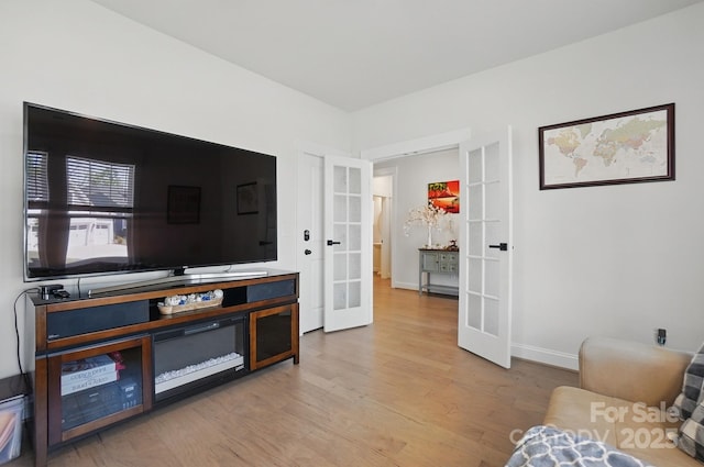 4120 Spring Cove Way, Belmont, NC 28012 - living area featuring baseboards, french doors, and wood finished floors