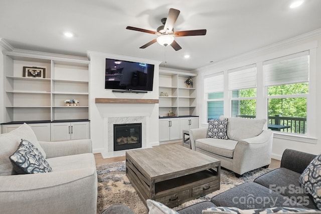 4120 Spring Cove Way, Belmont, NC 28012 - living room with crown molding, light wood-style floors, ceiling fan, a fireplace, and recessed lighting