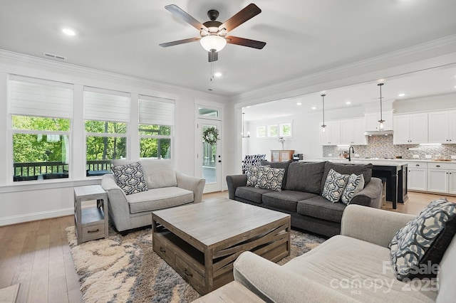 4120 Spring Cove Way, Belmont, NC 28012 - living area featuring light wood finished floors, a ceiling fan, recessed lighting, and ornamental molding