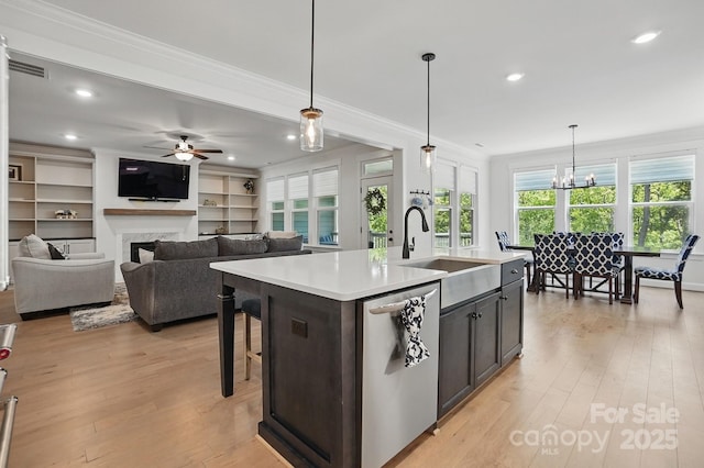 4120 Spring Cove Way, Belmont, NC 28012 - kitchen with a sink, ceiling fan with notable chandelier, dishwasher, light countertops, and visible vents