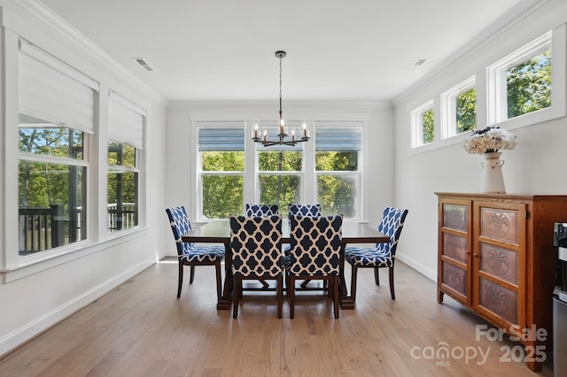 4120 Spring Cove Way, Belmont, NC 28012 - dining space with baseboards, visible vents, a chandelier, and ornamental molding