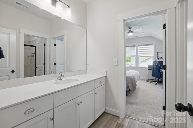 4120 Spring Cove Way, Belmont, NC 28012 - ensuite bathroom with a ceiling fan, wood finished floors, vanity, lofted ceiling, and visible vents