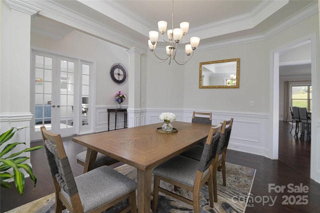 8313 Balcony Bridge Rd, Huntersville, NC 28078 - dining area featuring crown molding, a decorative wall, a chandelier, dark wood-type flooring, and french doors