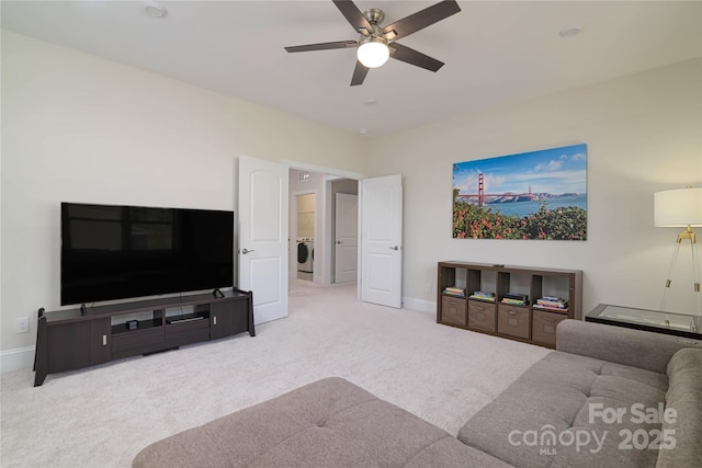 8313 Balcony Bridge Rd, Huntersville, NC 28078 - carpeted living room with washer / dryer, baseboards, and ceiling fan