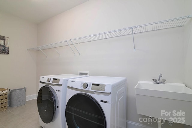 8313 Balcony Bridge Rd, Huntersville, NC 28078 - laundry room featuring washing machine and dryer, light tile patterned floors, and baseboards