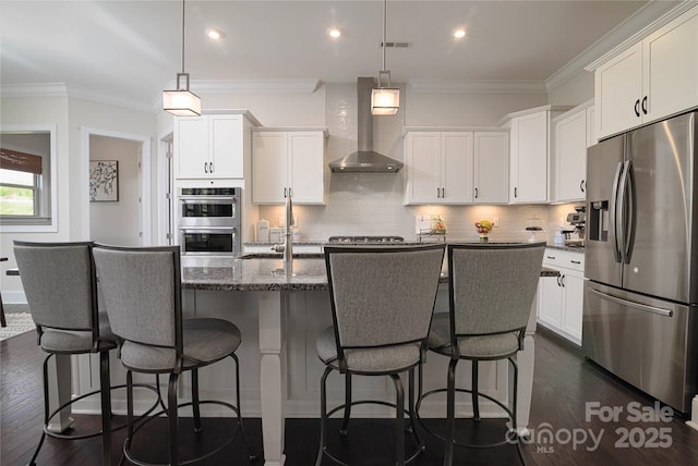 8313 Balcony Bridge Rd, Huntersville, NC 28078 - kitchen featuring appliances with stainless steel finishes, wall chimney range hood, a sink, dark wood-style floors, and white cabinetry