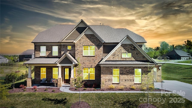 8313 Balcony Bridge Rd, Huntersville, NC 28078 - craftsman inspired home featuring covered porch, brick siding, and a lawn