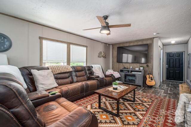 980 Lakeland Ave, Lincolnton, NC 28092 - living room with dark wood-style floors, a textured ceiling, and a ceiling fan